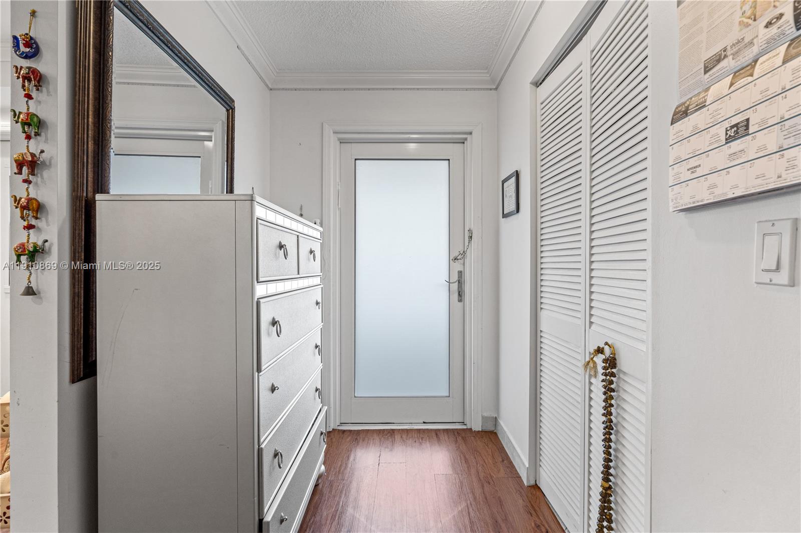 1425 Atlantic Shores Boulevard, Unit 409 Hallandale Beach, FL 33009 - Photo 26 of 30 a view of a hallway with wooden floor and staircase