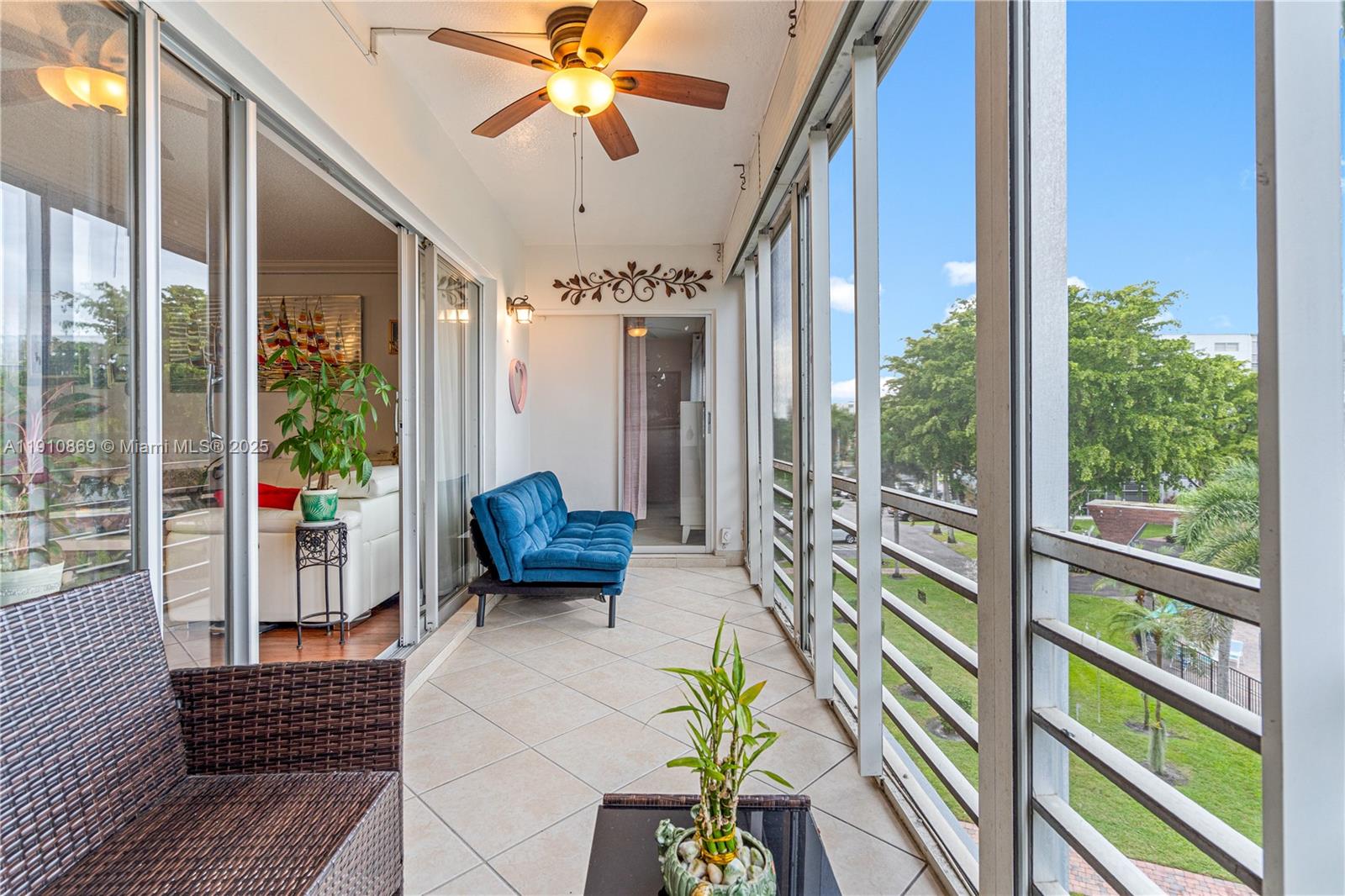 1425 Atlantic Shores Boulevard, Unit 409 Hallandale Beach, FL 33009 - Photo 29 of 30 a view of a porch with chairs and a potted plant