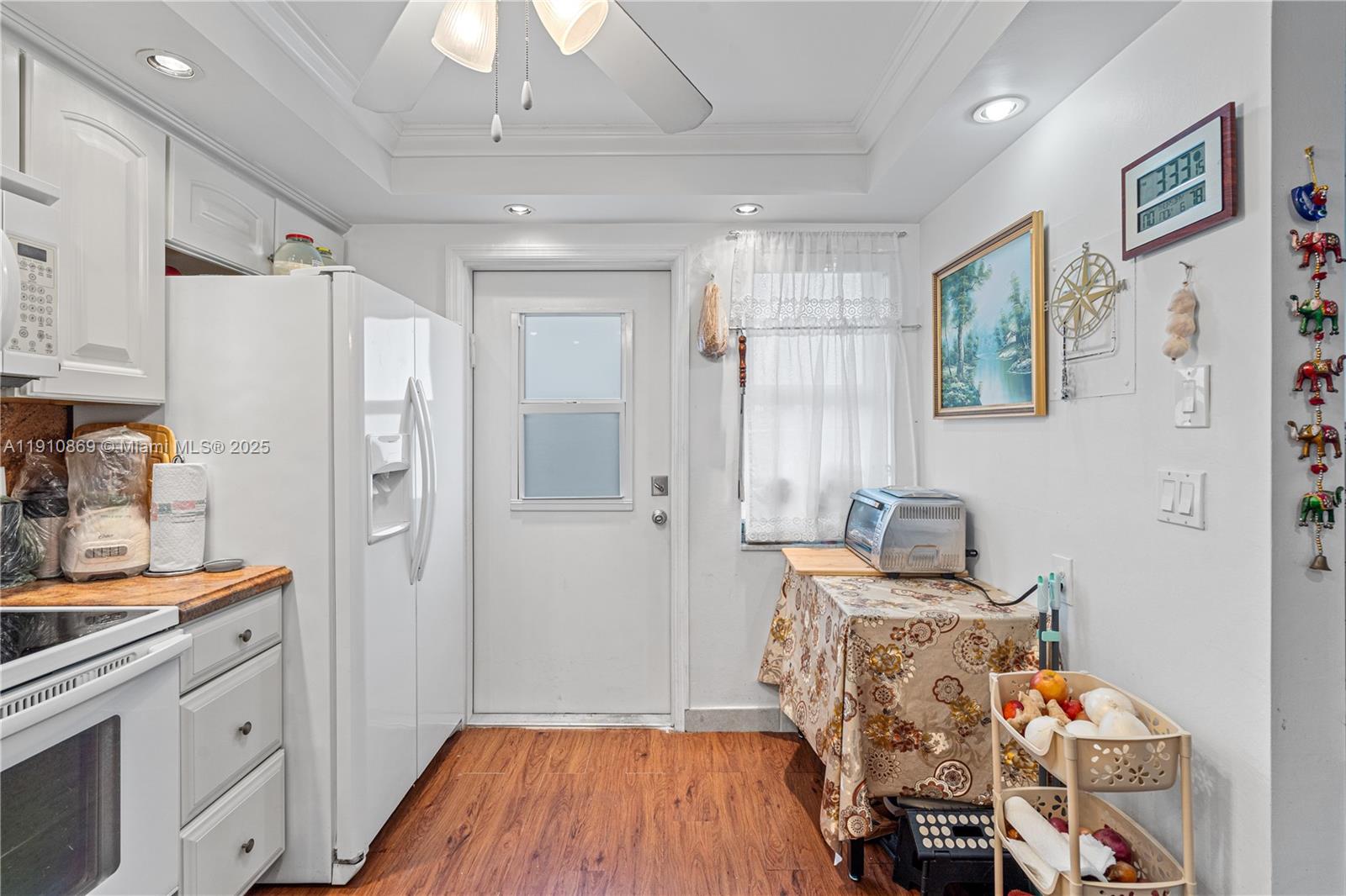 1425 Atlantic Shores Boulevard, Unit 409 Hallandale Beach, FL 33009 - Photo 8 of 30 a room with furniture a baby crib and a wooden floor