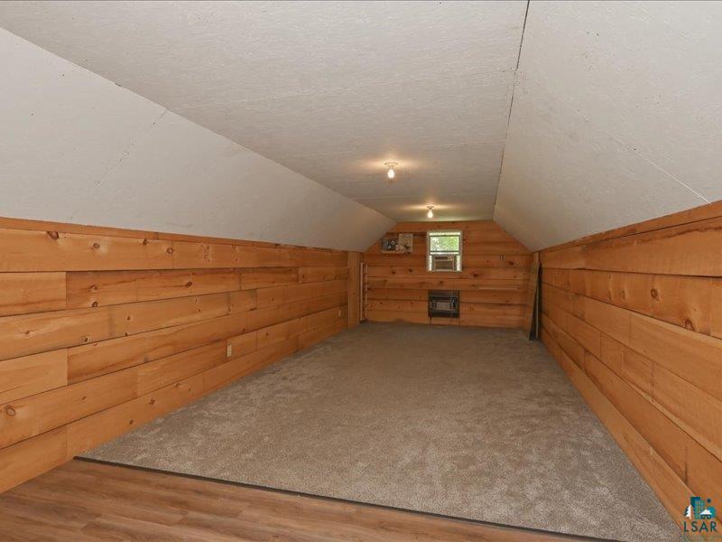 88440 Huron Street Cornucopia, WI 54827 - Photo 32 of 44 Above the detached garage is a bonus room. A finished 11'9" x 35' room with gas and electricity offers endless possibilities as an art studio, private retreat, or recreation room.