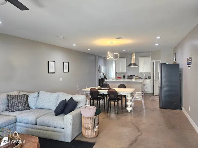 a kitchen with a refrigerator a stove top oven a sink and dishwasher