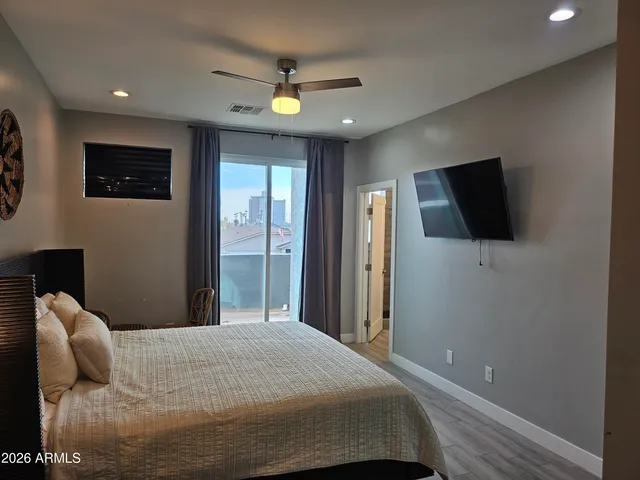 a room with a closet and wooden floor