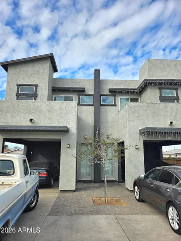 a view of a car park in front of house