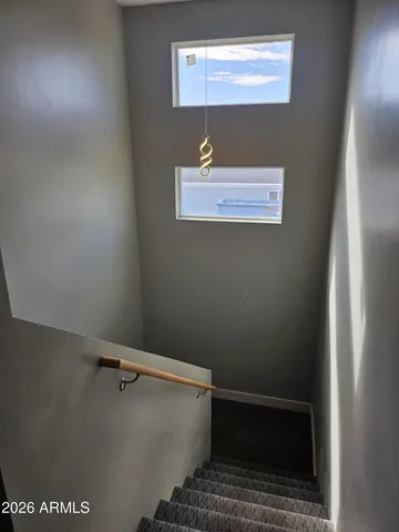 a room with a dresser and a window