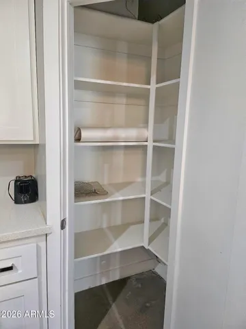 a stove top oven sitting inside of a kitchen