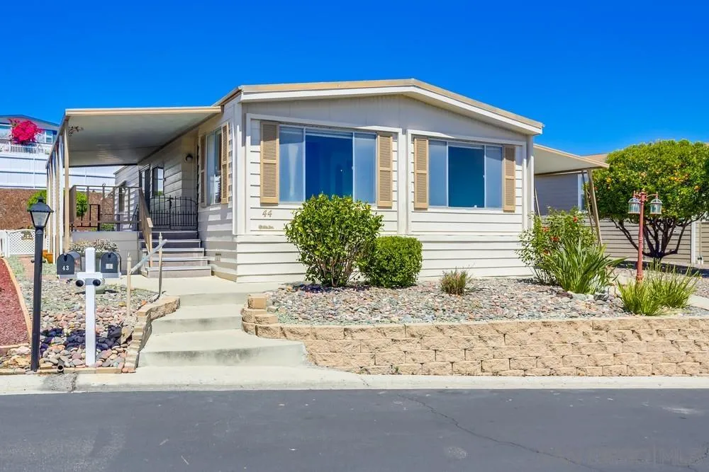 650 South Rancho Santa Fe Road, Unit 44 San Marcos, CA 92078 - Photo 1 of 25 a front view of a house with a yard