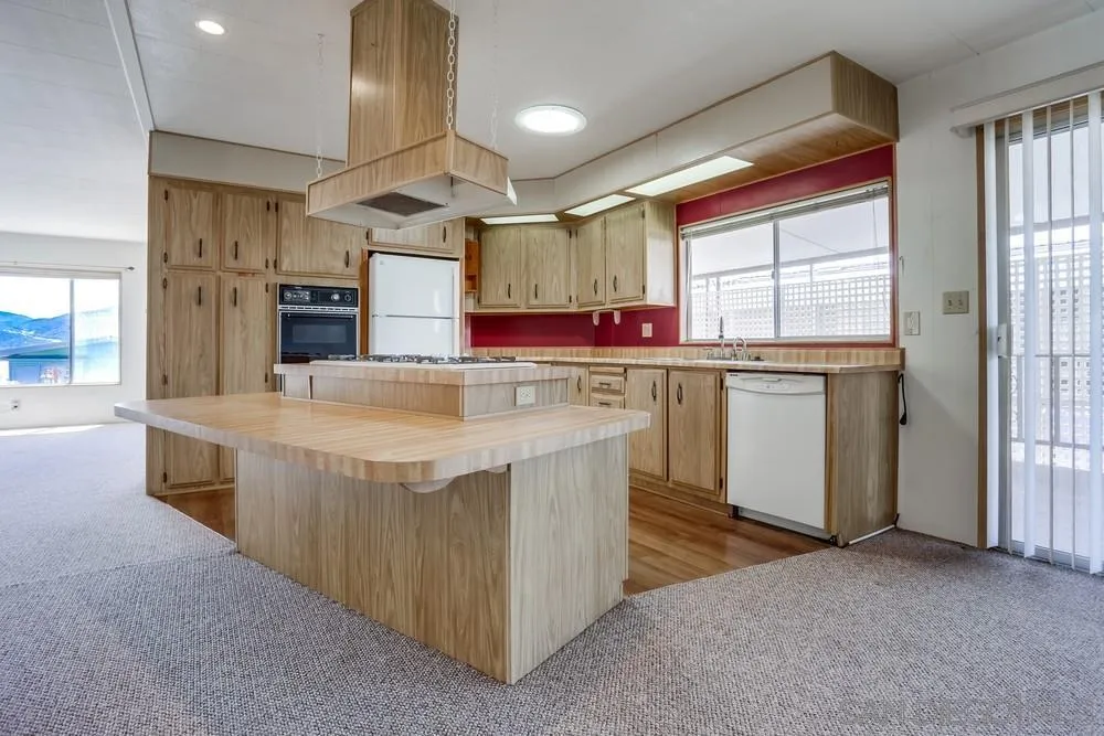 650 South Rancho Santa Fe Road, Unit 44 San Marcos, CA 92078 - Photo 11 of 25 a kitchen with a stove a refrigerator and windows