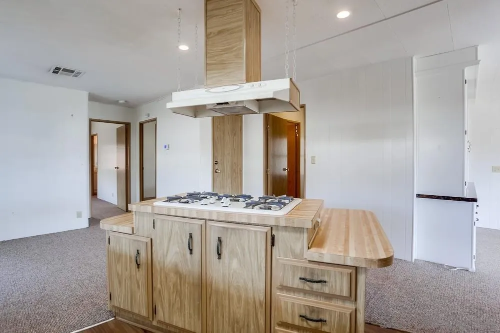 650 South Rancho Santa Fe Road, Unit 44 San Marcos, CA 92078 - Photo 13 of 25 a kitchen that has a stove and a table