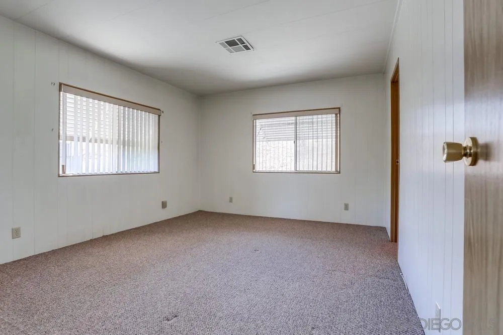 650 South Rancho Santa Fe Road, Unit 44 San Marcos, CA 92078 - Photo 16 of 25 an empty room with windows