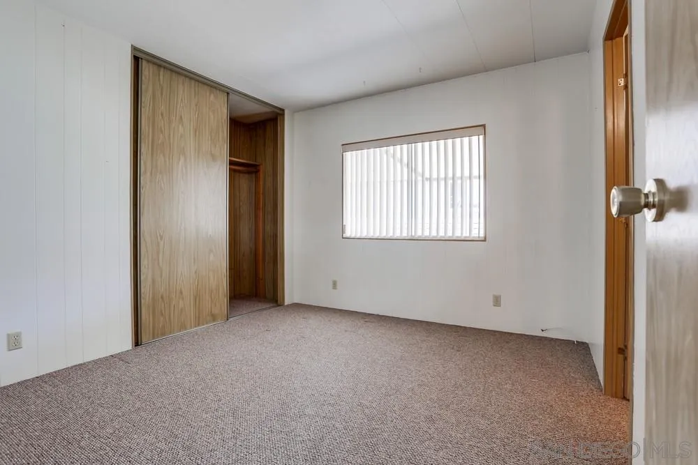 650 South Rancho Santa Fe Road, Unit 44 San Marcos, CA 92078 - Photo 19 of 25 an empty room with windows
