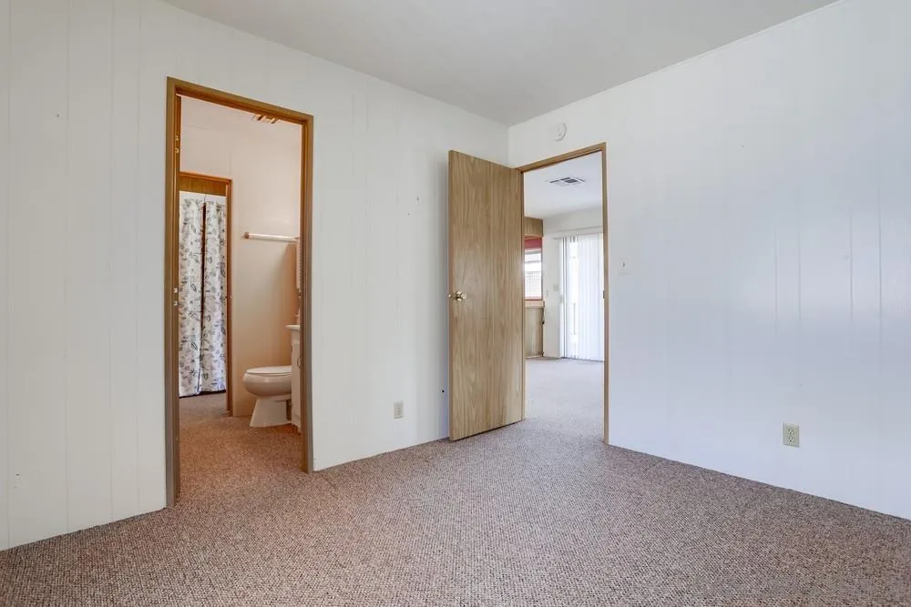 650 South Rancho Santa Fe Road, Unit 44 San Marcos, CA 92078 - Photo 20 of 25 a view of an empty room with closet and a window