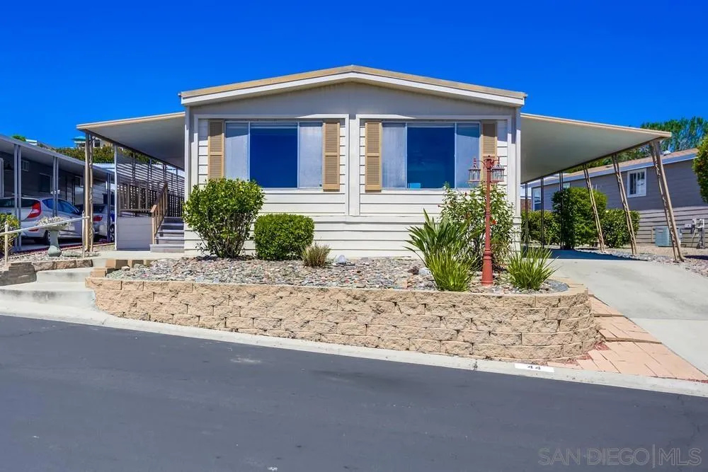 650 South Rancho Santa Fe Road, Unit 44 San Marcos, CA 92078 - Photo 2 of 25 a front view of a house with garden