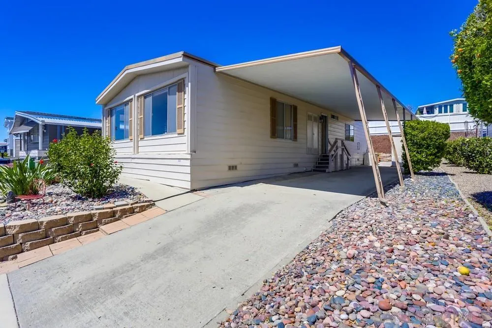 650 South Rancho Santa Fe Road, Unit 44 San Marcos, CA 92078 - Photo 3 of 25 a front view of a house with a yard