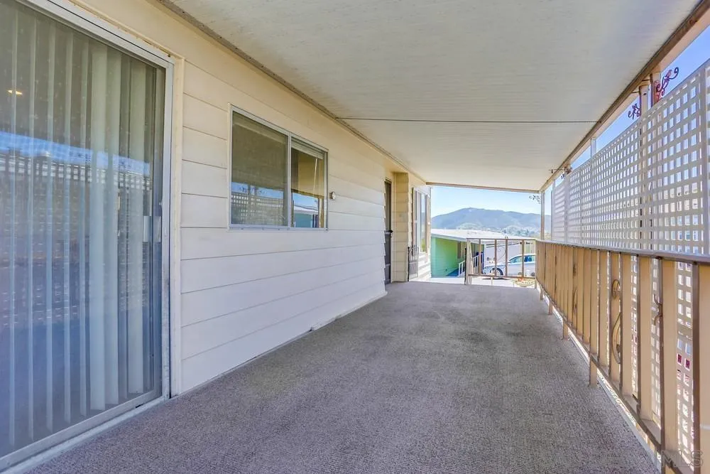 650 South Rancho Santa Fe Road, Unit 44 San Marcos, CA 92078 - Photo 5 of 25 a view of a house with a backyard