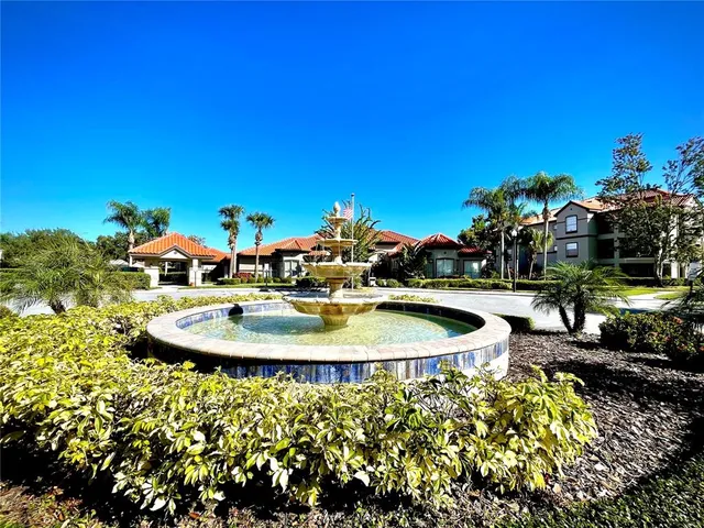a view of a swimming pool with outdoor seating