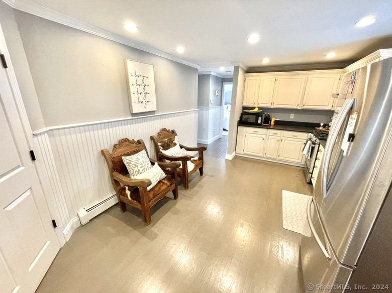 840 East Broadway, Unit 2 Milford, CT 06460 - Photo 6 of 15 a living room with furniture and a large window