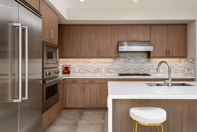 a view of a dining room with furniture large windows and wooden floor