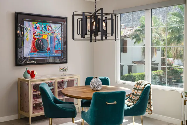 a room with furniture and painting on the wall