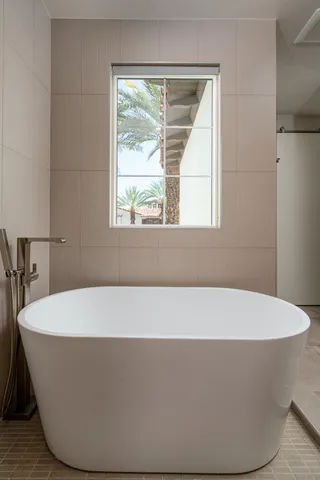 a bathroom with a sink a mirror and a shower