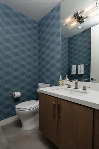a bathroom with a double vanity sink mirror and