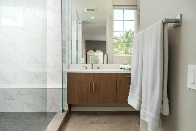 a view of a patio with couches table and chairs and potted plants