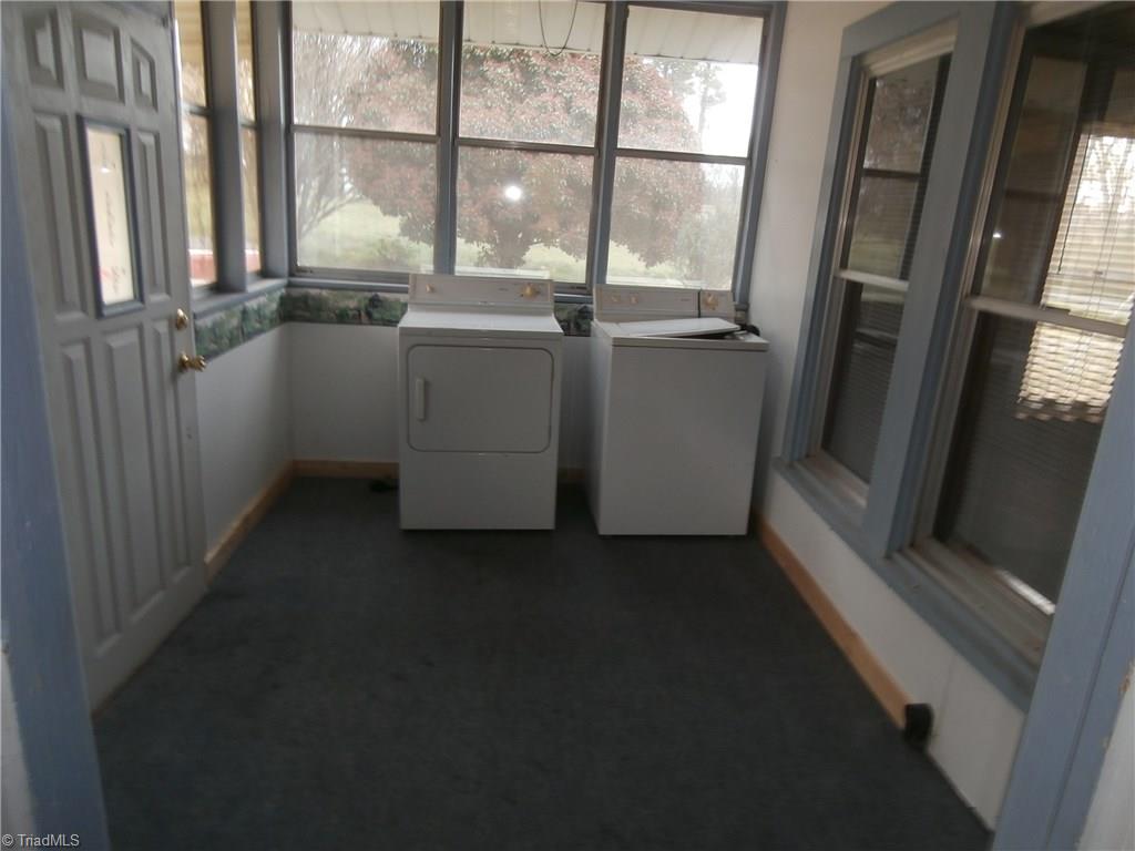 486 Jerry Frye Road Bennett, NC 27208 - Photo 11 of 16 Enclosed Back Port. Carpet. Washer and Dryer remain.