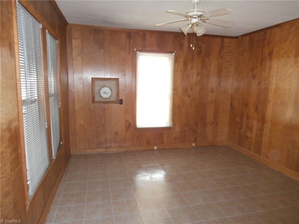 486 Jerry Frye Road Bennett, NC 27208 - Photo 3 of 16 Den. Vinyl Tiles. Paneling. Woodstove hookup.