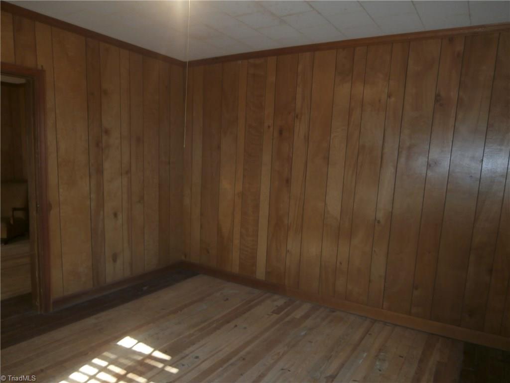 486 Jerry Frye Road Bennett, NC 27208 - Photo 8 of 16 Bedroom - Front Left. Paneled. Wood floor. No closet.