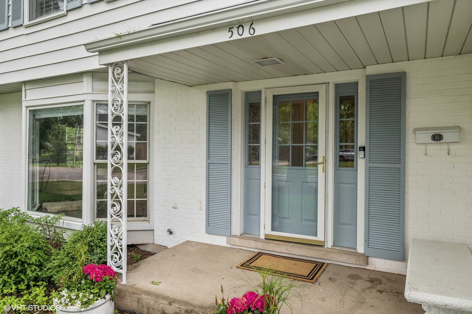 506 Westgate Road Deerfield, IL 60015 - Photo 2 of 39 a front view of a house with a potted plant and floor to ceiling window