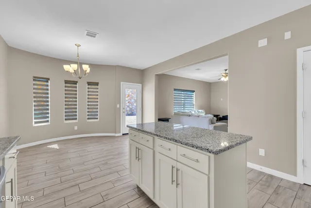 a kitchen with granite countertop a sink and a granite counter tops