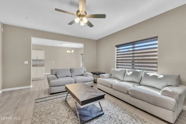 a living room with furniture and a large window