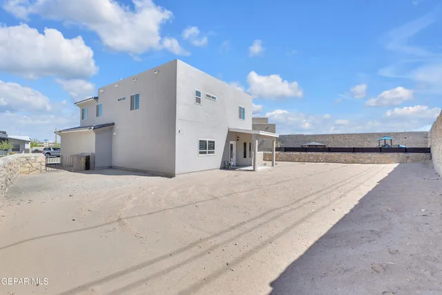 a view of living room with furniture and mirror