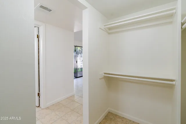 a bathroom with a shower and a sink
