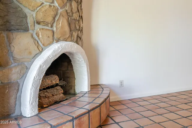 a kitchen with stainless steel appliances granite countertop a refrigerator a stove and a sink