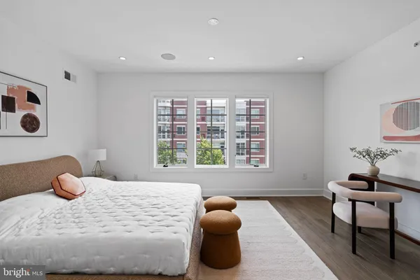 a bedroom with a bed and a couch