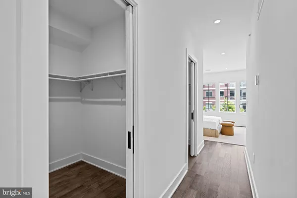 a bathroom with a tub sink shower and mirror