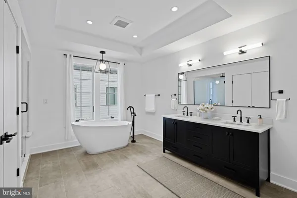 a bathroom with a bathtub and shower