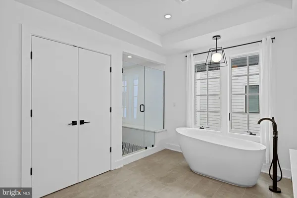 a bathroom with a granite countertop shower