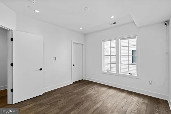a view of a kitchen with wooden floor
