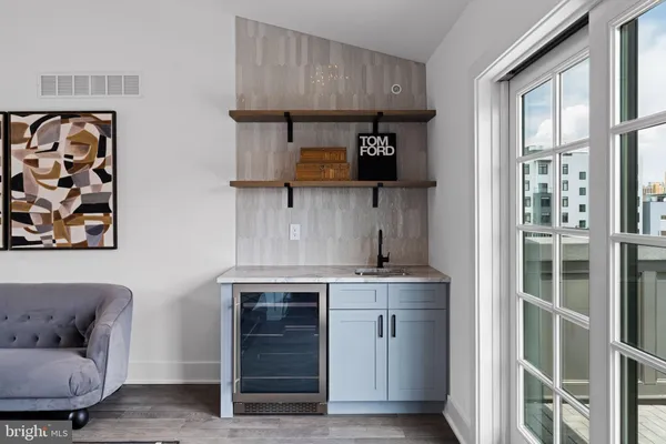 a view of workspace with wooden floor and windows