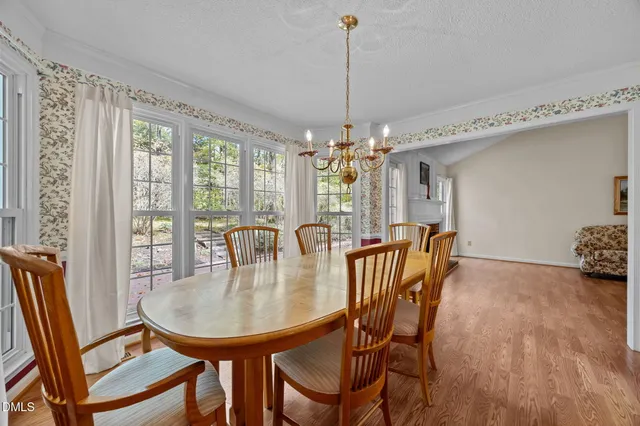 a kitchen with granite countertop a sink cabinets and stainless steel appliances