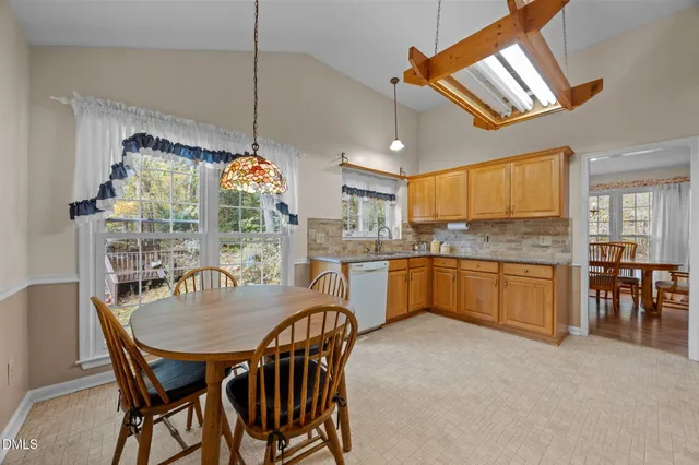 a utility room with washer and dryer wooden floor