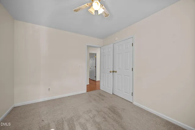 a bathroom with a granite countertop sink toilet a large mirror and shower