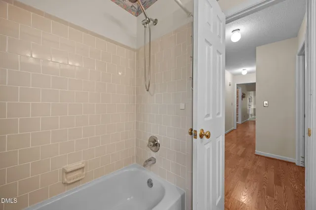 a bedroom with a large bed and a large window