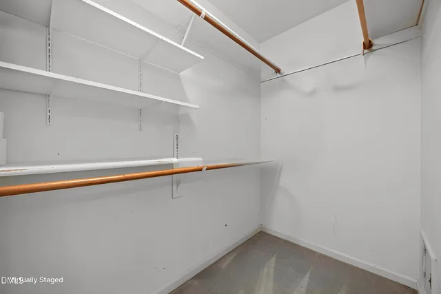 a bathroom with a double vanity sink a mirror and a bathtub