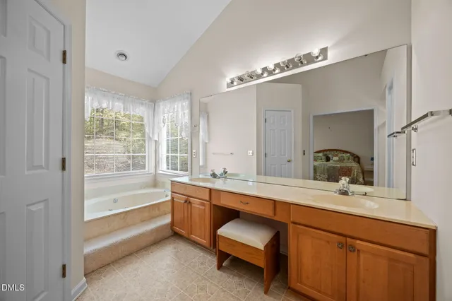 a bath tub sitting in a bathroom next to a window