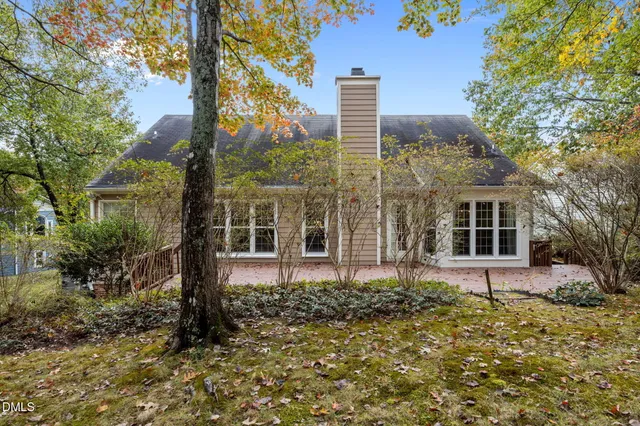 an aerial view of a house with a yard and garden