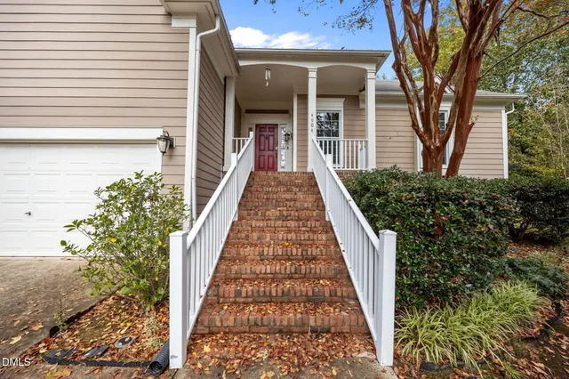 a view of a house with a yard and plants