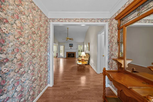 a very nice looking room with a large window and wooden floor