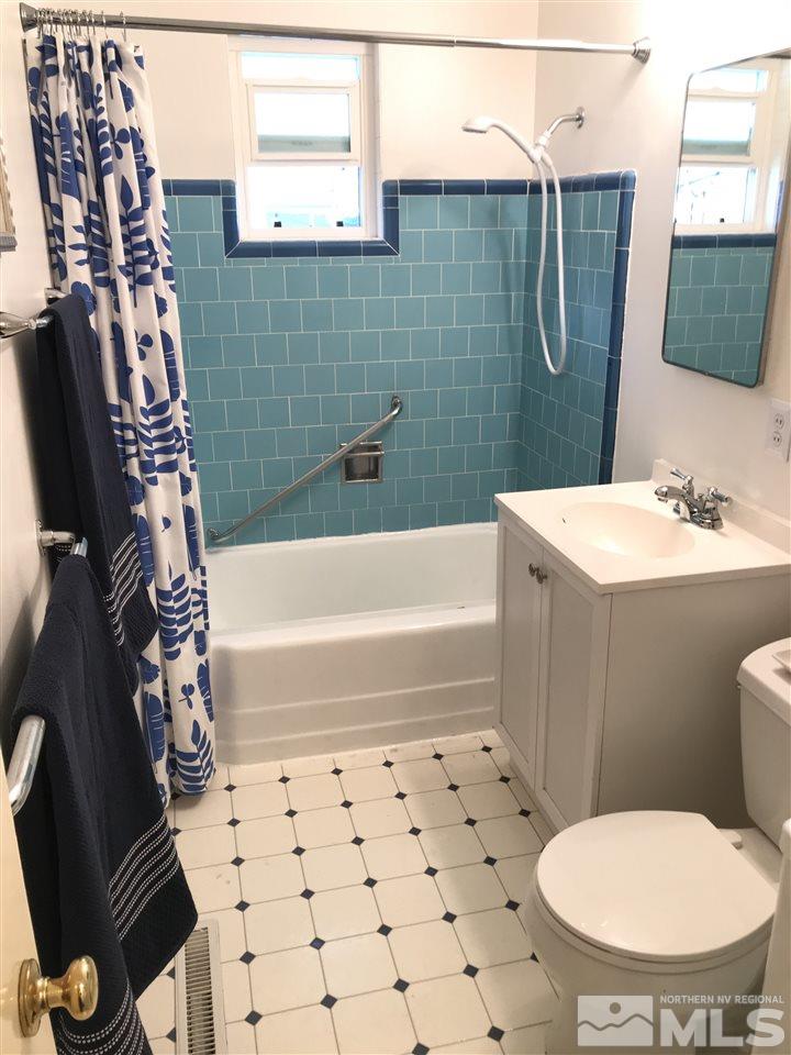 1205 Wilkinson Avenue Reno, NV 89502 - Photo 11 of 17 a bathroom with a sink toilet and shower